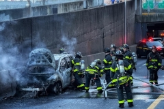Firefighters Extinguish a car fire on the FDR drive at E. 63rd St. today. 
There were no injuries
