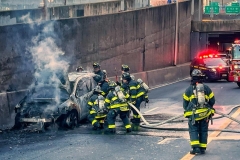 Firefighters Extinguish a car fire on the FDR drive at E. 63rd St. today. 
There were no injuries
