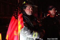 NEW YORK - Multi- Alarm residential fire guts home. Firefighters work to extinguish rapid moving fire. While Firefighters work on the fire Emergency Medical Service personnel wait to attend the injured.