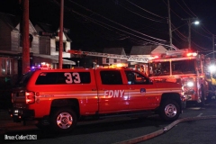 NEW YORK - Multi- Alarm residential fire guts home. Firefighters work to extinguish rapid moving fire. While Firefighters work on the fire Emergency Medical Service personnel wait to attend the injured.
