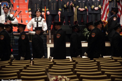 March 8, 2022  New York, 
Fire Department of The City of New York presents a Probationary Firefighter Graduation Ceremony at the Christian Cultural Center. 
.Flowers were placed where Probationary  firefighter Vincent Malveaux would have been seated. He died during a training exercise.