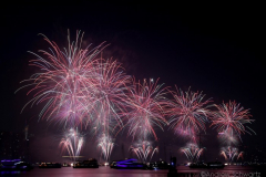 Fireworks light up the sky above the East River in New York City to celebrate Independence Day on July 4, 2021 in New York City. The fireworks were sponsored department store chain Macy's. (Photo by Andrew Schwartz)