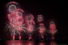 Fireworks light up the sky above the East River in New York City to celebrate Independence Day on July 4, 2021 in New York City. The fireworks were sponsored department store chain Macy's. (Photo by Andrew Schwartz)