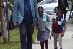 New York City starts the first day of school for Kindergarten students to eighth grade. On Thursday September 2, 2020 High School students will start classes.Teachers meet students outside of PS81x in the Riverdale section of the bronx they take the students temperature and then send them to meet other classmates and start the school day.Dad walks his children to first day of classes
