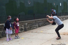 New York City starts the first day of school for Kindergarten students to eighth grade. On Thursday September 2, 2020 High School students will start classes.Teachers meet students outside of PS81x in the Riverdale section of the bronx they take the students temperature and then send them to meet other classmates and start the school day.Mom taking photos on the first day of class