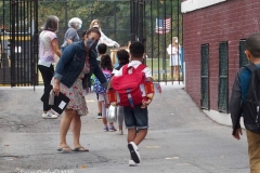 New York City starts the first day of school for Kindergarten students to eighth grade. On Thursday September 2, 2020 High School students will start classes.Teachers meet students outside of PS81x in the Riverdale section of the bronx they take the students temperature and then send them to meet other classmates and start the school day.Dawn Knecht Teacher welcomes students