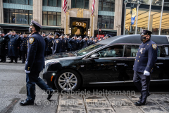 Thousands of police officers pay their respect as the hearse with the casket of fallen NYPD Officer Wilbert Mora makes its way down 5th Avenue in New York, New York, on Feb. 2, 2022. (Photo by Gabriele Holtermann/Sipa USA)