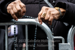 A woman prays the rosary during the funeral service of NYPD Officer Wilbert Mora at St. Patrick’s Cathedral in New York, New York, on Feb. 2,  2022.  (Photo by Gabriele Holtermann/Sipa USA)