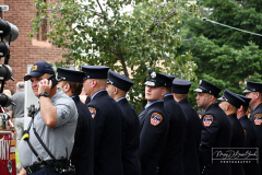 Monday, August 30, 2021
FDNY Line Of Duty Funeral
Staten Island, NY
Photographs by Mary DiBiase Blaich 

Firefighter Stephen J Reilly was remembered today with a Funeral Mass at Sacred Heart Church in Staten Island.  He died of cancer related to his 9/11 service. After the funeral Mass, family members were presented with FDNY items, including his helmet.
Attending were his company, Engine 155, Fire Commissioner Daniel Nigro, and many firefighters, family, and friends.  During the funeral, a call came in for a high angle rescue of a worker, and some of the mourners who were on duty left with lights and sirens.  One firefighter holds his handy talkie to listen to the “run”. While another looks down the street to view responding tower ladder #79.