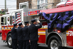 Monday, August 30, 2021
FDNY Line Of Duty Funeral
Staten Island, NY
Photographs by Mary DiBiase Blaich 

Firefighter Stephen J Reilly was remembered today with a Funeral Mass at Sacred Heart Church in Staten Island.  He died of cancer related to his 9/11 service. After the funeral Mass, family members were presented with FDNY items, including his helmet.
Attending were his company, Engine 155, Fire Commissioner Daniel Nigro, and many firefighters, family, and friends.  During the funeral, a call came in for a high angle rescue of a worker, and some of the mourners who were on duty left with lights and sirens.  One firefighter holds his handy talkie to listen to the “run”. While another looks down the street to view responding tower ladder #79.