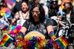 A man on a motorcycle at the New York City Pride March.