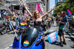 A woman on a motorcycle at the New York City Pride March.