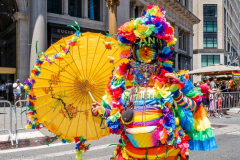 A man in a rainbow costume at the New York City Pride March.