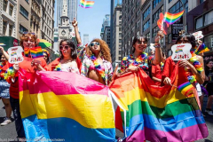 People wth rainbow flags at the New York City Pride March.