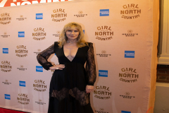 Luba Mason (Mrs. Burke) takes the red carpet.