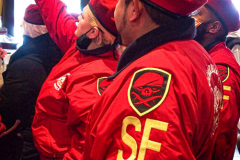 Guardian Angels from all over 5 Boroughs schlepped through the snow and met in Washington Heights at the Angelica’s Uptown Cafe on W 187th Street to celebrate the 43rd Anniversary of the beloved and renowned establishment begun by Curtis Sliwa in the Bronx with just 13 kids in 1979. 
Several hundred came to show their respects and to celebrate where Officials and Heads of the Districts and Chapters spoke and gave out awards to the outstanding representatives and Guardians of 2021.
“We are no different from one another. Guardian Angels have given people a purpose, a duty of providing safety and security amongst their communities,” was exclaimed. 
“Crime has gone up and recruitment is harder,” were other sentiments shared on not only local but Global as well. The Guardian Angels spans now 13 countries across the Globe with Japan holding 21 chapters alone. International presence was provided via ZOOM during the event.
Many people who have been involved in Guardian Angels have moved onto other areas of security jobs and the security sectors.
Sliwa encouraged the importance of keeping streets safe especially in times of uncertainty and the power of community and most of all harmony amongst all.
Manhattan, NYC. February 13, 2022. (C) Bianca Otero