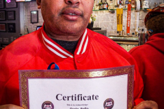 Guardian Angels from all over 5 Boroughs schlepped through the snow and met in Washington Heights at the Angelica’s Uptown Cafe on W 187th Street to celebrate the 43rd Anniversary of the beloved and renowned establishment begun by Curtis Sliwa in the Bronx with just 13 kids in 1979. 
Several hundred came to show their respects and to celebrate where Officials and Heads of the Districts and Chapters spoke and gave out awards to the outstanding representatives and Guardians of 2021.
“We are no different from one another. Guardian Angels have given people a purpose, a duty of providing safety and security amongst their communities,” was exclaimed. 
“Crime has gone up and recruitment is harder,” were other sentiments shared on not only local but Global as well. The Guardian Angels spans now 13 countries across the Globe with Japan holding 21 chapters alone. International presence was provided via ZOOM during the event.
Many people who have been involved in Guardian Angels have moved onto other areas of security jobs and the security sectors.
Sliwa encouraged the importance of keeping streets safe especially in times of uncertainty and the power of community and most of all harmony amongst all.
Manhattan, NYC. February 13, 2022. (C) Bianca Otero