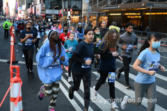 March 20, 2022: The 2022 United Airlines NYC Half Marathon is held in New York City. The course starts in Prospect Park in Brooklyn and ends in Central Park in Manhattan. The Rising New York Road Runner races in Times Square. (Photos by Jon Simon)