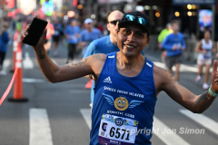 March 20, 2022: The 2022 United Airlines NYC Half Marathon is held in New York City. The course starts in Prospect Park in Brooklyn and ends in Central Park in Manhattan. The Rising New York Road Runner races in Times Square. (Photos by Jon Simon)