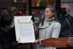 Maria Torres-Springer Deputy Mayor handing the Proclamation to May Chin owner and business partner of Hello Deli. Celebrating the 30th anniversary on Jan 31 2022.