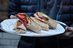 yRupert Jee holding Mayor Adam’s Vegan Power Wrap outside Hello Deli celebrating the 30th anniversary on Jan 31 2022.
