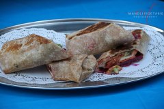 ©Manoli Figetakis PhotographyMayor Adam’s Vegan Power Wrap outside Hello Deli celebrating the 30th anniversary on Jan 31 2022.