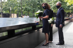 Kathy Hochul, Governor of New York, and Michael Bloomberg, founder of Bloomberg LP, right, lay flowers over the inscribed names of those who were killed in the 2001 and 1993 terrorist attacks at the edge of a memorial pool at the National September 11 Memorial & Museum in New York, U.S., on Wednesday, Sept. 8, 2021. This year marks the 20th anniversary of the attacks on the World Trade Center towers in New York