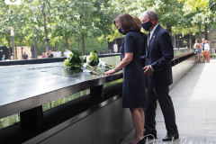 Kathy Hochul, Governor of New York, and Michael Bloomberg, founder of Bloomberg LP, right, lay flowers over the inscribed names of those who were killed in the 2001 and 1993 terrorist attacks at the edge of a memorial pool at the National September 11 Memorial & Museum in New York, U.S., on Wednesday, Sept. 8, 2021. This year marks the 20th anniversary of the attacks on the World Trade Center towers in New York