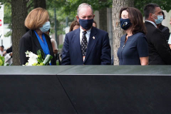 Kathy Hochul, Governor of New York, and Michael Bloomberg, founder of Bloomberg LP, right, lay flowers over the inscribed names of those who were killed in the 2001 and 1993 terrorist attacks at the edge of a memorial pool at the National September 11 Memorial & Museum in New York, U.S., on Wednesday, Sept. 8, 2021. This year marks the 20th anniversary of the attacks on the World Trade Center towers in New York