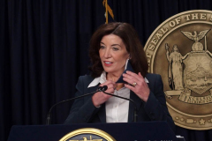 February 9, 2022  New York   Gov. Kathy Hochul  in a press conference today in her N.Y.C. office said she is lifting the state’s business mask mandate on Thursday February 10,2022 as New York emerges from a deadly wave of Omicron cases — but will still require them in schools for now.