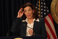February 9, 2022  New York   Gov. Kathy Hochul  in a press conference today in her N.Y.C. office said she is lifting the state’s business mask mandate on Thursday February 10,2022 as New York emerges from a deadly wave of Omicron cases — but will still require them in schools for now.