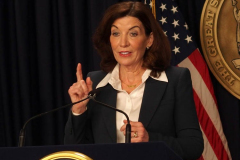 February 9, 2022  New York   Gov. Kathy Hochul  in a press conference today in her N.Y.C. office said she is lifting the state’s business mask mandate on Thursday February 10,2022 as New York emerges from a deadly wave of Omicron cases — but will still require them in schools for now.