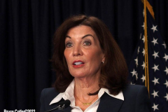 February 9, 2022  New York   Gov. Kathy Hochul  in a press conference today in her N.Y.C. office said she is lifting the state’s business mask mandate on Thursday February 10,2022 as New York emerges from a deadly wave of Omicron cases — but will still require them in schools for now.