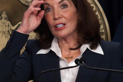 February 9, 2022  New York   Gov. Kathy Hochul  in a press conference today in her N.Y.C. office said she is lifting the state’s business mask mandate on Thursday February 10,2022 as New York emerges from a deadly wave of Omicron cases — but will still require them in schools for now.