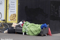December 27, 2021  New York , homeless person found a sofa that was tossed out in the trash and is using it as his bed in the streets of New York City.
