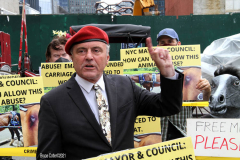 New York,  Representatives from NYCLASS, PETA and other community advocates engage in a protest outside the 38th Street stable to demand immediate action from the city to save the life of an injured, emaciated horse that was being forced to pull carriages while exhibiting open wounds. Transit Workers Union 100 hold up signs to counter protest the event.
Curtis Sliwa who is running for N.Y.C. Mayor next year holds sign and speaks at the podium.