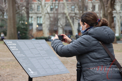 A women capturing information about the installation that is located at Madison Square Park, New York City on 27 Jan 2022.