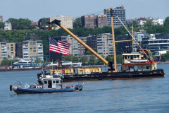 May 30 2022  NEW YORK  - Intrepid Air and Space Museum Memorial Day wreath ceremony commemorating  military personnel past and present. New York Police Department Harbor Unit patrol the piers