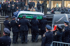Funeral for NYPD Rookie Cop JASON RIVERA, was held at the St. Patrick’s Cathedral in Mid-Town Manhattan. 
RIVERA only 22, died in a routine domestic call in Manhattan along with another Officer, Wilbert Mora, 27. Thousands of NYPD officers attended as well as family members, friends and colleagues of now post-humously promoted, Detective JASON RIVERA. New York, NY (C) Bianca Otero