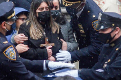 Funeral for NYPD Rookie Cop JASON RIVERA, was held at the St. Patrick’s Cathedral in Mid-Town Manhattan. 
RIVERA only 22, died in a routine domestic call in Manhattan along with another Officer, Wilbert Mora, 27. Thousands of NYPD officers attended as well as family members, friends and colleagues of now post-humously promoted, Detective JASON RIVERA. New York, NY (C) Bianca Otero