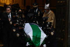 NYPD Officers carry the casket of fallen officer Jason Rivera.