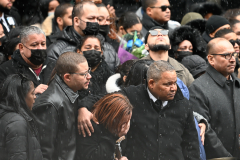 The family of slain officer Jason Rivera becomes emotional during his funeral.