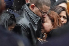 Family members, mourners