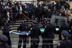 NYPD officers fold the American Flag that drapped the casket of NYPD Officer Jason Rivera after his funeral service at St. Patrick’s Cathedral in New York, New York, on Jan. 28, 2022.  (Photo by Gabriele Holtermann/Sipa USA)