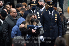 Dominique Luzuriaga watches as the casket of her husband, NYPD Officer Jason Rivera is loaded into a hearse after his funeral service at St. Patrick’s Cathedral in New York, New York, on Jan. 28, 2022.  (Photo by Gabriele Holtermann/Sipa USA)