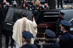 A priest blesses the casket of NYPD Officer Jason Rivera after his funeral service at St. Patrick’s Cathedral in New York, New York, on Jan. 28, 2022.  (Photo by Gabriele Holtermann/Sipa USA)
