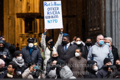 A woman holds up a sign in support of the NYPD after the funeral service for NYPD Officer Jason Rivera at St. Patrick’s Cathedral in New York, New York, on Jan. 28, 2022.  (Photo by Gabriele Holtermann/Sipa USA)