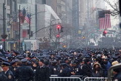 Police officers from around the country gather at St. Patrick's Cathedral to attend the funeral for fallen NYPD Officer Jason Rivera on January 28, 2022 in New York City. The 22-year-old NYPD officer was shot and killed on January 21 in Harlem while responding to a domestic disturbance call. Rivera's partner, Officer Wilbert Mora, also died from injuries suffered in the shooting