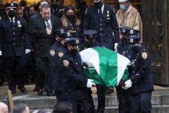 The casket of fallen NYPD Officer Jason Rivera is brought out of St. Patrick's Cathedral during his funeral on January 28, 2022 in New York City. The 22-year-old NYPD officer was shot and killed on January 21 in Harlem while responding to a domestic disturbance call. Rivera's partner, Officer Wilbert Mora, also died from injuries suffered in the shooting