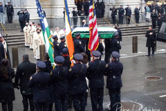 The casket of fallen NYPD Officer Jason Rivera is brought out of St. Patrick's Cathedral during his funeral on January 28, 2022 in New York City. The 22-year-old NYPD officer was shot and killed on January 21 in Harlem while responding to a domestic disturbance call. Rivera's partner, Officer Wilbert Mora, also died from injuries suffered in the shooting